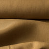 Rustic Spiced Clay linen fabric with a natural texture and medium drape, perfect for creating timeless fashion pieces.