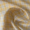 Summery Daffodil Check Linen Fabric with yellow and grey checks, offering a lightweight and delicate slub texture for airy summer garments.