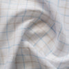 Yarn-dyed check pattern linen fabric in earth and sky hues, ideal for elegant and natural clothing.