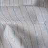 Yarn-dyed striped linen fabric in earth and sky tones, perfect for creating elegant and comfortable apparel.