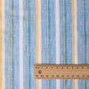 Vibrant Summer Beach Stripe linen fabric with chambray blues and summertime yellow stripes, ideal for fresh and classic summer garments.