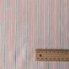 Summery Peach Sorbet Stripe 100% linen fabric with green and deep peach threads, ideal for soft draping summer dresses and tunics