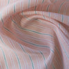 Summery Peach Sorbet Stripe 100% linen fabric with green and deep peach threads, ideal for soft draping summer dresses and tunics