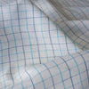 Summer Blues Check 100% Linen Fabric featuring fine blue checks on a white background, ideal for a variety of summer garments