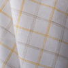 Creamy Lemon Oatmeal Check Linen Fabric, featuring sunshine yellow and earthy checks on white linen, with a fine weave for a soft feel and elegant drape..