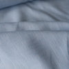 Icy Baby Blue 100% Linen Fabric in a soft baby blue tone with a slubbed texture. Ideal for dresses, shirts, loose pants, and tunics. Weighs 150 GSM and is 147 CM wide. Fine weave may require lining. Softens beautifully with washes and wears.