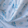 Lightweight-medium weight Blue Botanical Breeze linen fabric with subtle plaid weave and blue floral prints