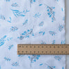 Lightweight-medium weight Blue Botanical Breeze linen fabric with subtle plaid weave and blue floral prints