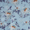 Blue Floral Linen Fabric, lightweight 135 GSM, with delicate white and orange flowers and blue and purple foliage on a soft blue background, ideal for summer dresses and home decor