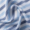 Lightweight Summertime Blues linen fabric with alternating blue stripes, ideal for creating elegant and breezy summer apparel.