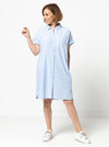 Lady wearing a blue dress made with the Blaire Dress Sewing Pattern – Shirtmaker style with shirt tail and inset pockets.