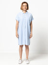 Lady wearing a blue dress made with the Blaire Dress Sewing Pattern – Shirtmaker style with shirt tail and inset pockets.