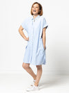 Lady wearing a blue dress made with the Blaire Dress Sewing Pattern – Shirtmaker style with shirt tail and inset pockets.