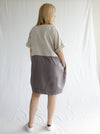 back view of women wearing linen eme dress made using Eme Dress sewing pattern by Style Arc, featuring a loose-fitting cocoon shape, perfect for summer, and suitable for linen, rayon, silk, cotton, and fine wool fabrics.