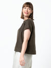 front view of lady wearing linen top made using Ethel Designer Top sewing pattern by Style Arc, featuring a square shape, angled design lines, and wide facings, suitable for linen, crepe, silk, and light wool fabrics.