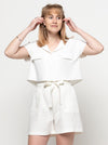 A versatile Monty 2-in-1 sewing pattern for a shirt and dress with a neat revere collar and extended shoulder line, suitable for various fabrics.