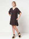 Stylish Pixie shift dress sewing pattern with short flounce sleeves, hem flounce, and a ‘V’ neck, designed for an easy fit and suitable for luxurious fabrics like silk and crepe