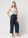 Clare Pant Sewing Pattern with wide leg, elastic waist, tie belt, angled pockets, and front pleats, perfect for fabrics like linen, crepe, or fine wool