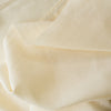 Cream 100% linen fabric in cream color, light-medium weight, perfect for sewing garments.