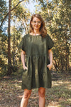 lady wearing green linen dress made using Fawn Dress Set Sewing Pattern - Versatile Dresses with Pockets in Two Bodice Styles