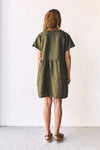 lady wearing green linen dress made using Fawn Dress Set Sewing Pattern - Versatile Dresses with Pockets in Two Bodice Styles