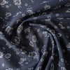 Dark navy 100% linen fabric with white daisy floral pattern, light-blue and ochre details, suitable for summer clothing