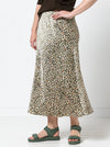 Lady wearing a Genoa Bias Cut Skirt made using the Genoa Bias Cut Skirt sewing pattern, in animal print fabric, pull-on elastic waist, ankle-length design.