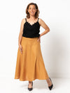 Haven Woven Skirt Sewing Pattern - mid-length skirt with fitted waist, invisible zip, flared hem with curved seams, and shaped waistband.