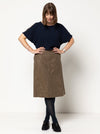 front view of Mary-Ann A-Line Skirt Sewing Pattern by Style Arc featuring a 4-panel design, slant pockets, and invisible zip, made with woven fabrics like linen or cotton