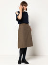 front view of Mary-Ann A-Line Skirt Sewing Pattern by Style Arc featuring a 4-panel design, slant pockets, and invisible zip, made with woven fabrics like linen or cotton