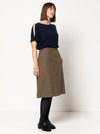 front view of Mary-Ann A-Line Skirt Sewing Pattern by Style Arc featuring a 4-panel design, slant pockets, and invisible zip, made with woven fabrics like linen or cotton