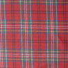 Close-up of Outback Tartan Linen fabric showcasing a vibrant red, green, blue, and yellow plaid pattern, suitable for sewing garments and home textiles.