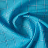 Soft and smooth Pop of Blue Plaid 100% Linen Fabric, featuring a balanced check pattern in aqua, royal blue, and white, ideal for dressmaking and napery