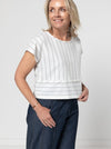 Quinn Woven Top sewing pattern with square cut, extended shoulder line, boxy shape, and front and back panelling.