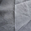 Seamist 100% Linen Fabric with a unique denim-like twill weave in greenish-grey. Features purplish grey and green warp fibers with white weft fibers, perfect for sturdy garments like jackets, pants, structured dresses, and skirts. Soft, smooth hand, tight weave, and heavy drape.