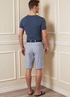 Vogue sewing pattern for men’s shorts and pants, featuring waistband, pockets, fly front zipper, and tailored design, ideal for twill, denim, and gabardine fabrics.