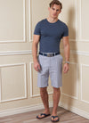 Vogue sewing pattern for men’s shorts and pants, featuring waistband, pockets, fly front zipper, and tailored design, ideal for twill, denim, and gabardine fabrics.