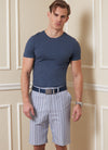 Vogue sewing pattern for men’s shorts and pants, featuring waistband, pockets, fly front zipper, and tailored design, ideal for twill, denim, and gabardine fabrics.